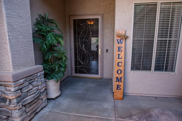 Entrance of a care home with a welcome sign