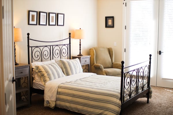 Cozy bedroom with bed and seating area