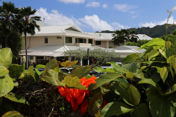 Exterior view of the nursing facility surrounded by greenery