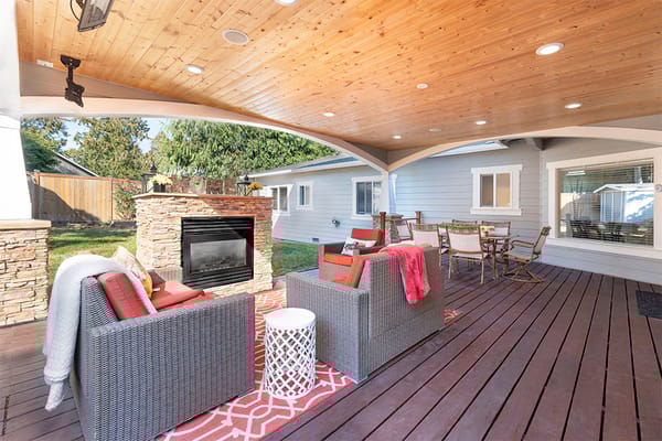 Covered outdoor seating area with comfortable furniture