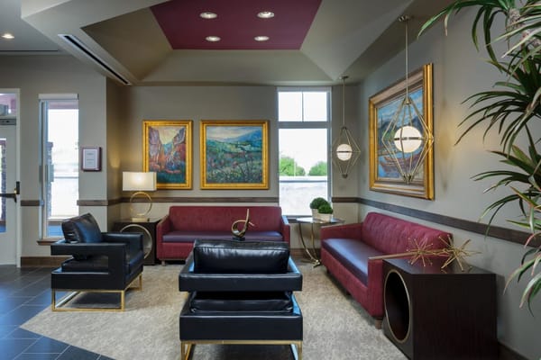Lounge area with paintings and comfortable seating