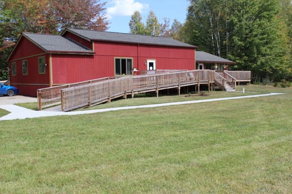 Exterior view of a red assisted living facility
