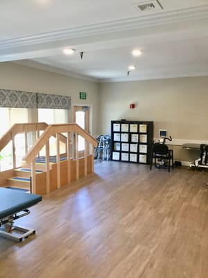 Interior view of a rehabilitation space with gym equipment