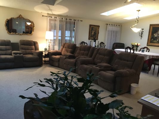 Cozy common area with recliners and artwork