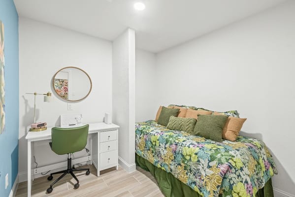 Cozy private resident room with a bed and desk