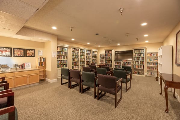 Cozy library with bookshelves and seating