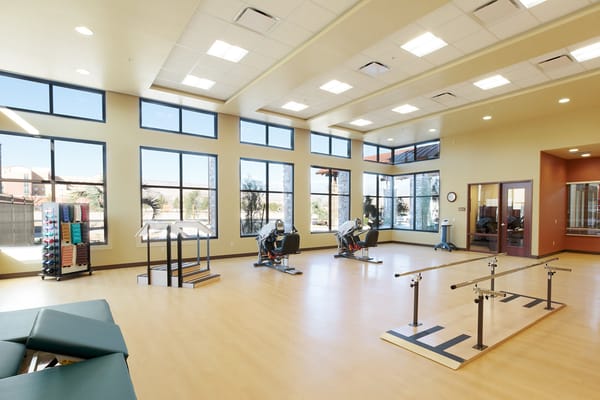 Bright rehabilitation room with exercise equipment