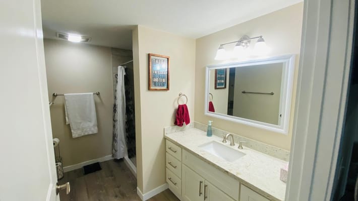 Clean bathroom with modern fixtures and lighting