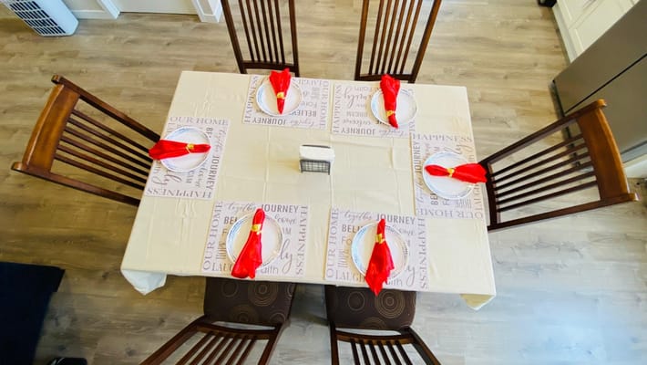 Dining table set for a meal in a shared area