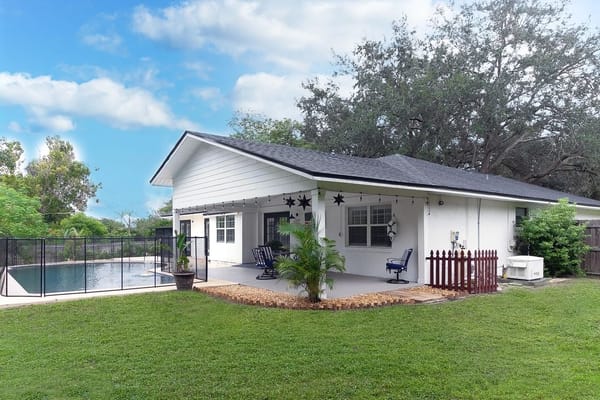 Exterior view of a residential facility with pool