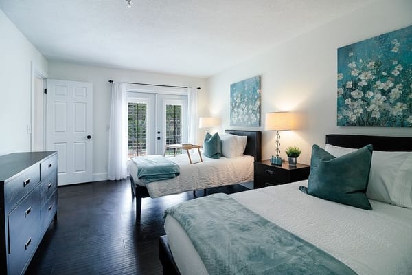 Bright, modern shared bedroom with floral decor