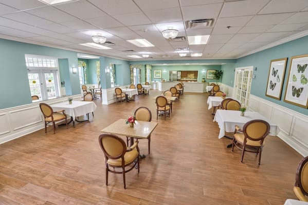 Bright dining area with tables and chairs