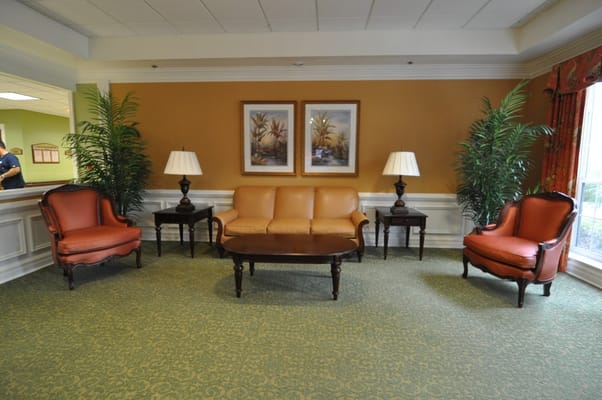 Cozy lounge area with seating and plants