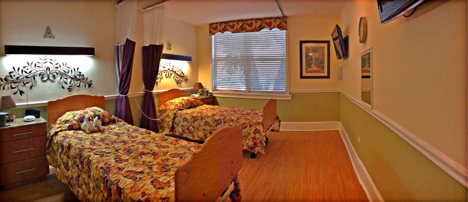 Bright interior of a shared resident room with two beds