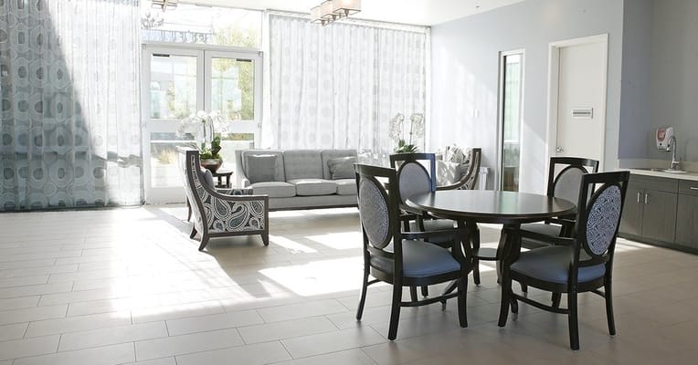 Bright common area with seating and dining table
