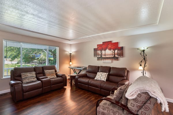 Cozy common area with leather sofas and artwork