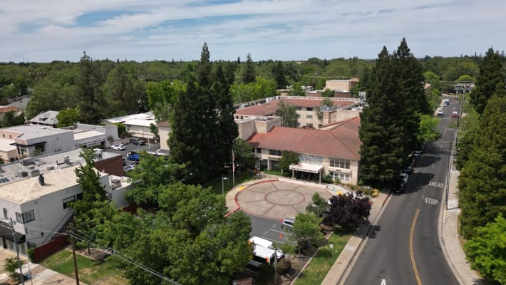 Aerial view of the facility surrounded by greenery