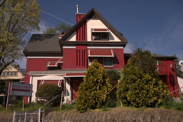 Exterior view of a red assisted living facility