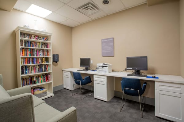 Interior view of a computer area with bookshelves