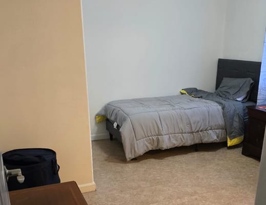 Simple resident room with bed and furniture