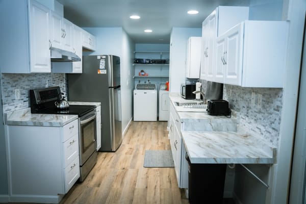 Bright kitchen area with modern appliances