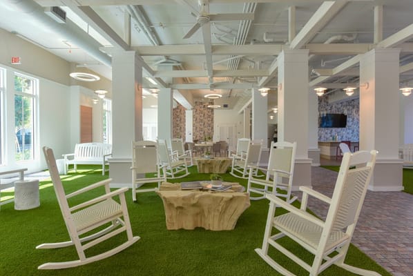 Bright interior common area with rocking chairs