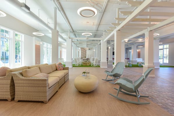 Bright common area with comfortable seating and natural light