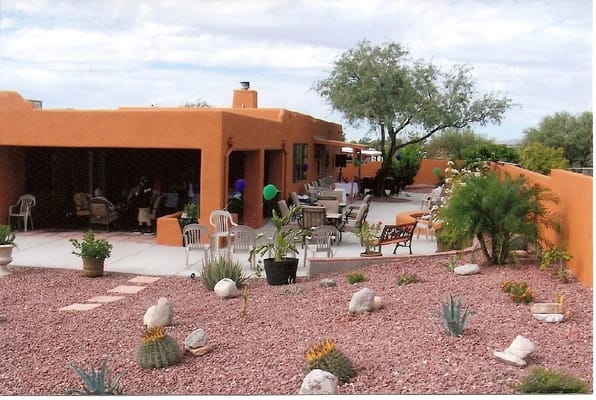 Outdoor patio area with seating and plants