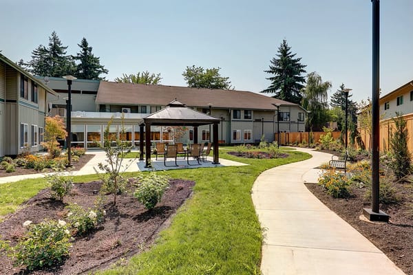Well-maintained outdoor garden area with gazebo.