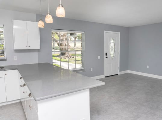 Spacious kitchen and living room with modern finishes
