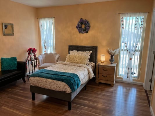 Cozy resident room with bed and seating area