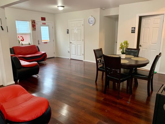 Bright common area with seating and dining table