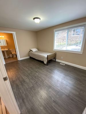 Private room with a bed and bathroom access