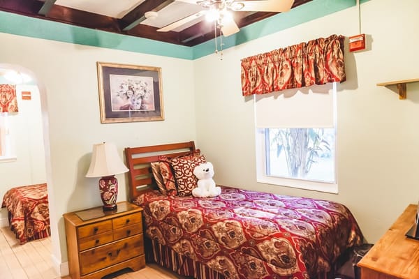 Cozy resident room with a bed, lamp, and decor