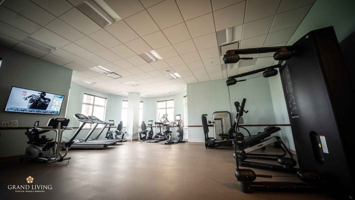 A well-equipped fitness room with gym equipment