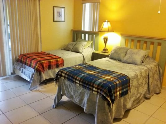 Brightly decorated resident room with two beds