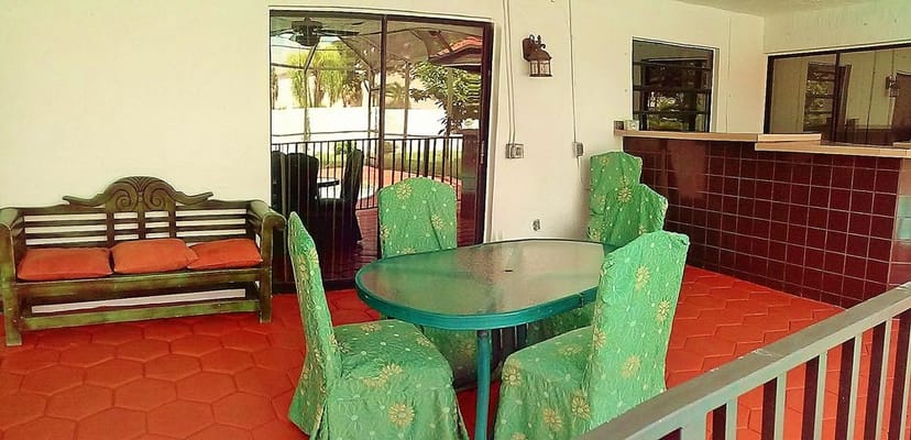 Outdoor seating area with round table and chairs