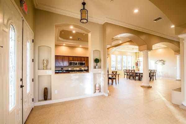 Spacious lobby area with kitchen and dining space