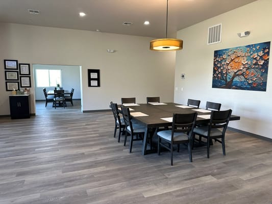 Common area with dining table and artwork