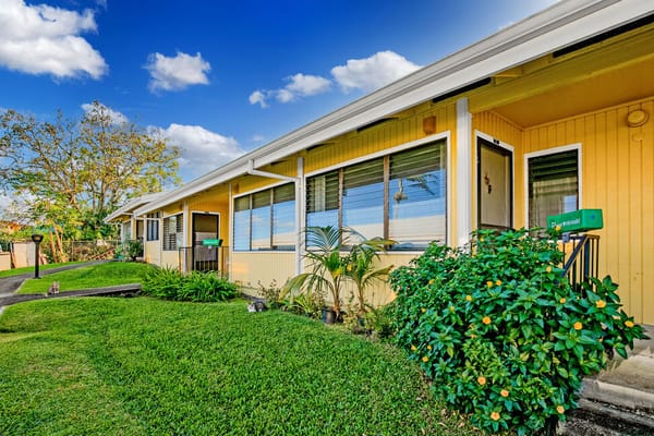 Exterior view of Haili Elderly Apartments with garden