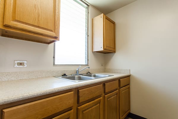 Kitchen with wooden cabinets and sink