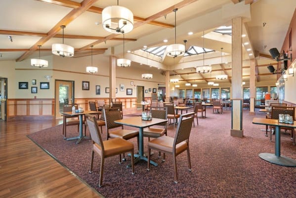Bright dining room with tables and chairs