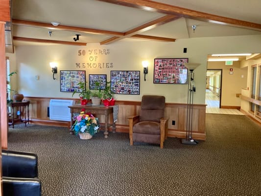 Common area with memory collage and seating