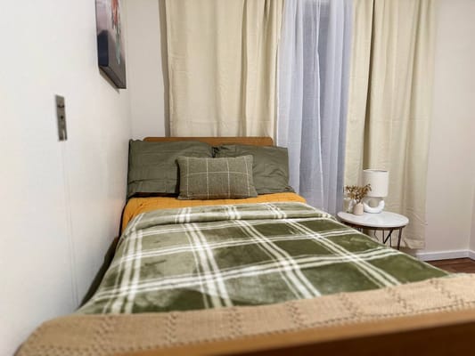 Cozy private bedroom with bedding and decor