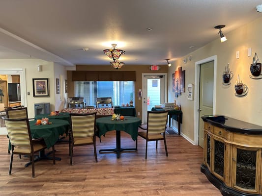 Dining area with tables and chairs in a warm interior