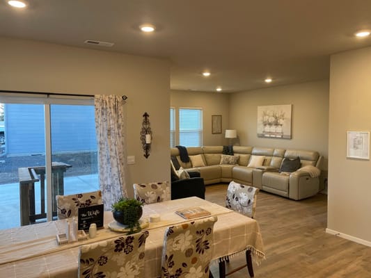 Bright common area with seating and dining space