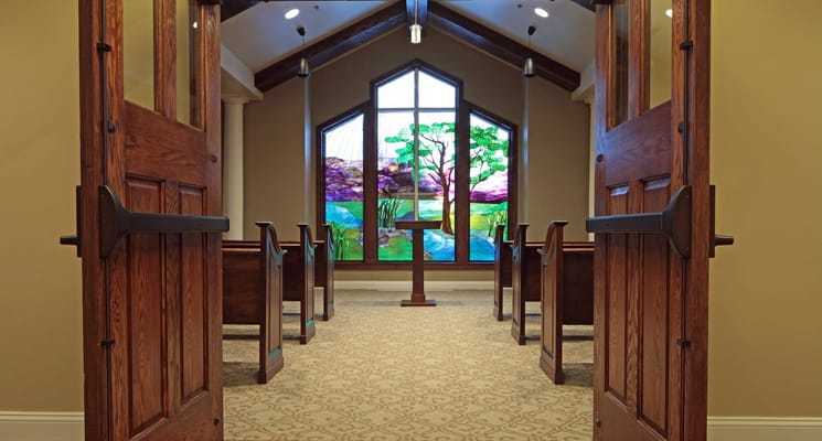 Interior view of a chapel with stained glass windows