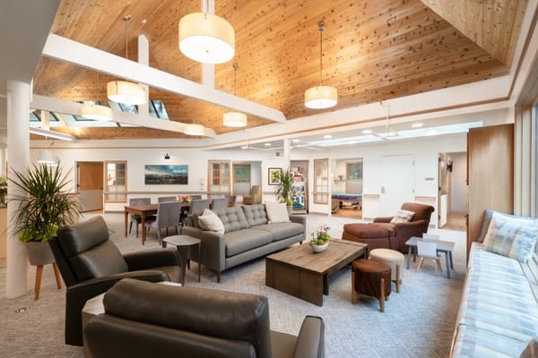 Bright common area with comfortable seating and natural light