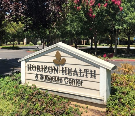 Sign of Horizon Health & Subacute Center surrounded by greenery