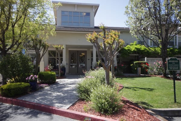 Front entrance of Pacific Gardens with landscaping